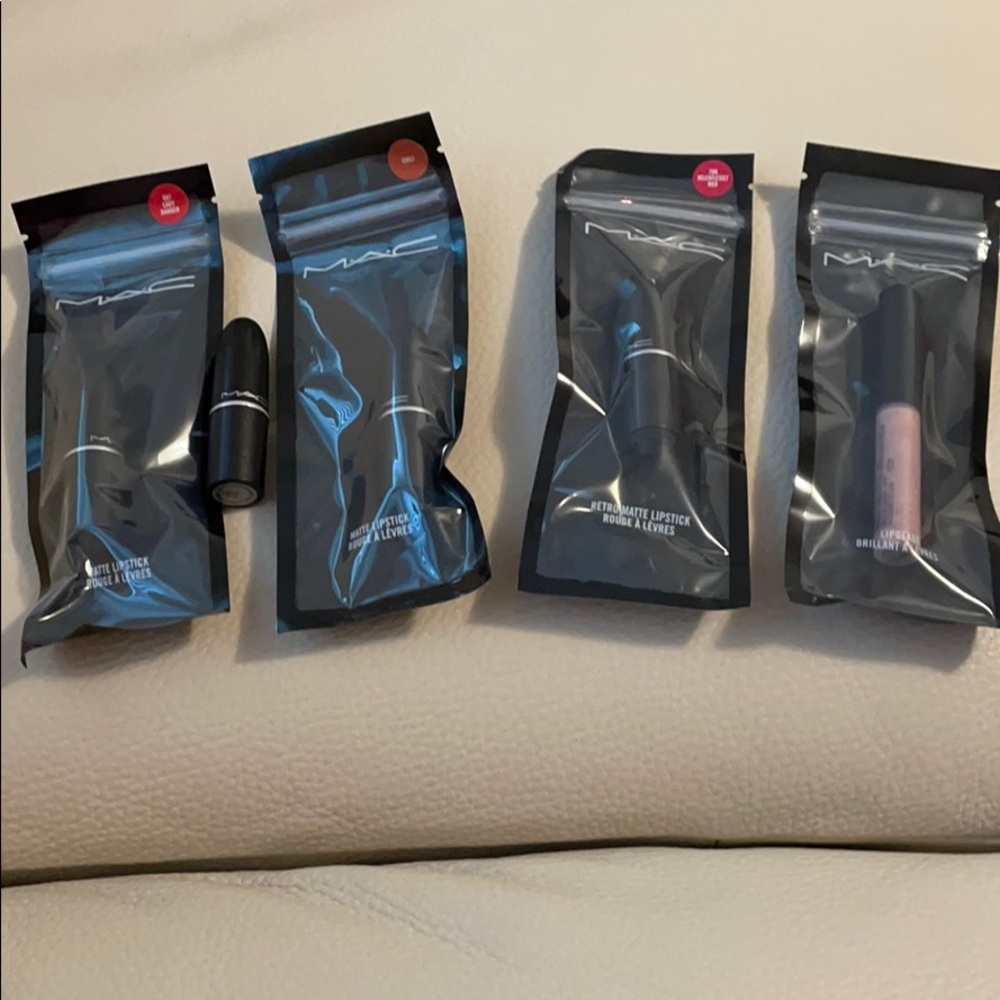 Set of 4 MAC mini lipsticks and 1 Lipgloss.